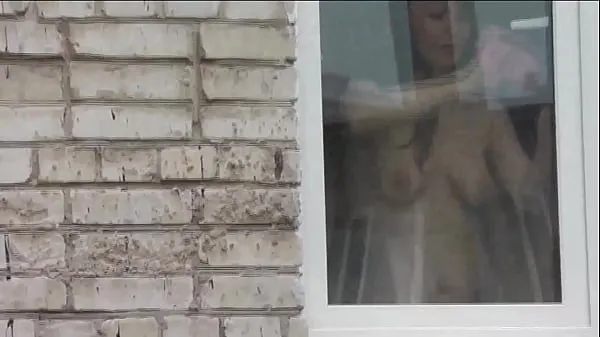 XXX Naked in public. Nude. Outdoor. Outside. Husband Sexy Frina is spying on her from car window when she washes apartment window no panties and bra मेरे वीडियो